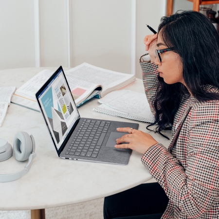 Young woman looking at her computer screen